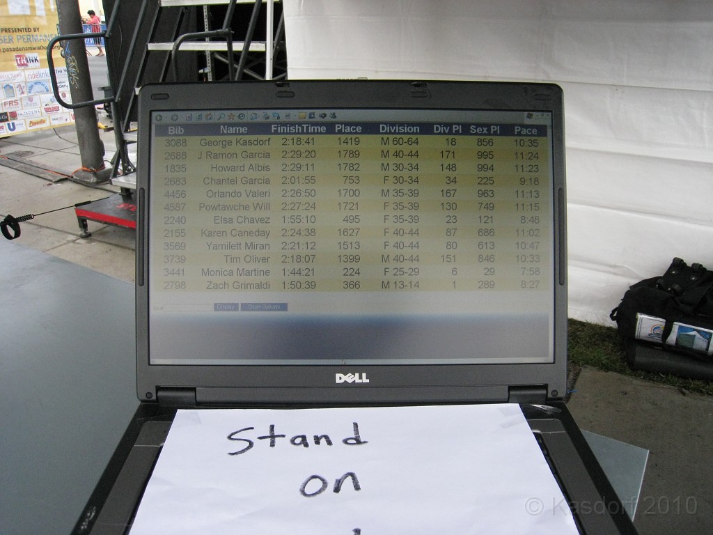 Pasadena Marathon California 2010-02 0760.jpg - Cool feature at this race. Stand on a timing mat and it pulls up your information. No waiting for them to print out hard copy and hang it up.